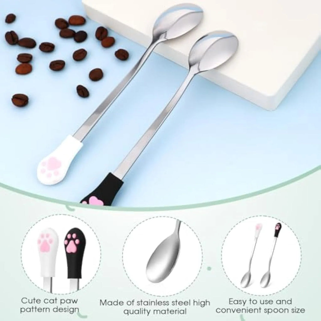 Two pet food spoons with cat paw design in white and black colours