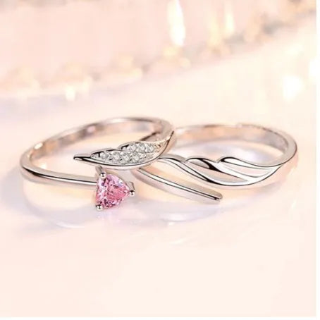 Silver adjustable heart diamond ring with geometric design on a plain background