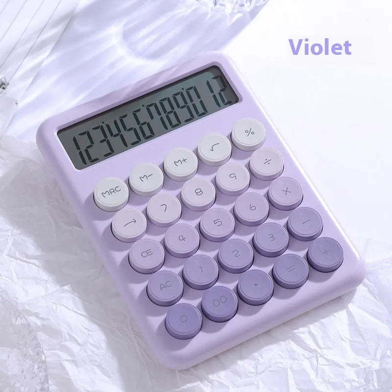 12-digit gradient colour desktop calculator in violet, blue, green, or pink on a desk