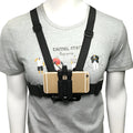 Black mobile phone chest mount harness on torso with adjustable straps and phone clip