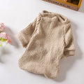 Brown cloth sweater pullover on a small dog, showing casual style and fit.