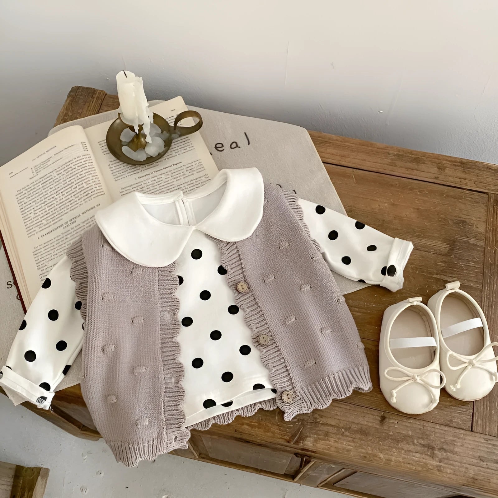 Children's knitted polka dot vest in apricot with single-breasted closure, featuring a sleeveless design for spring and autumn