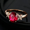 Women's copper butterfly ring with heart design in 18k rose gold tone, blue and red options