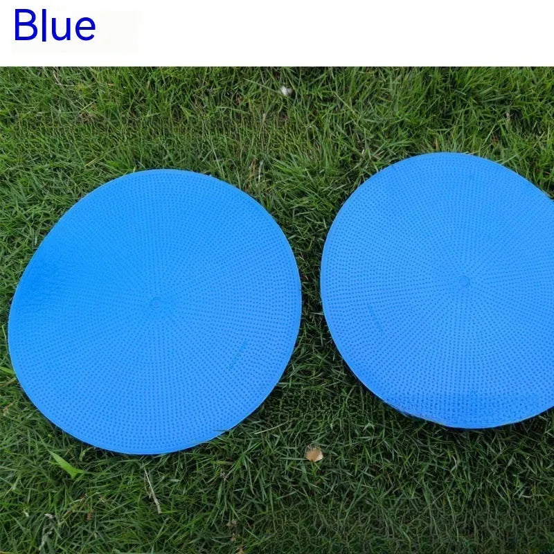 Multi-colour 23 cm diameter soft TPE football training target disc on grass