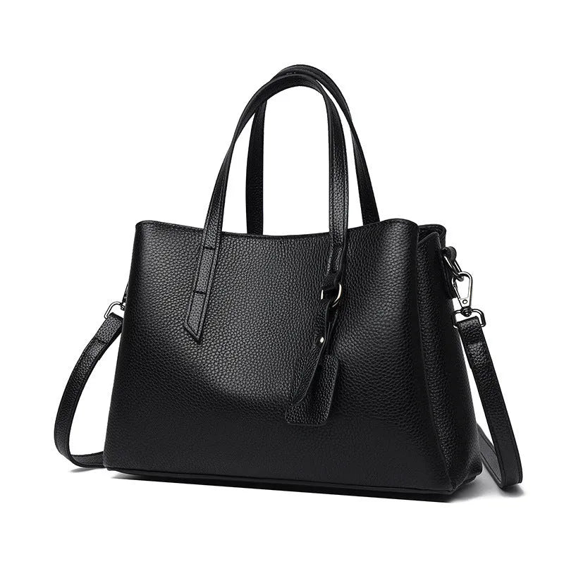 Women's cowhide leather shoulder handbag in horizontal square design with internal compartments