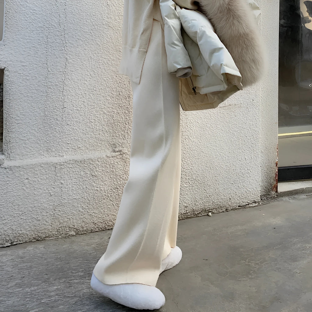 Women's cream white high-waist wide-leg knitted trousers for winter with a drooping mopping hem.