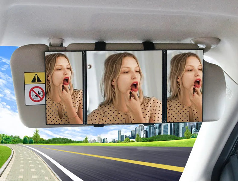 Silver car folding makeup mirror shown closed at 15.5 cm and opened at 30.5 cm wide.