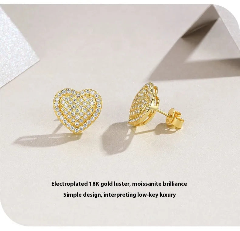 Heart-shaped moissanite stud earrings in gold-plated silver with minimalist design