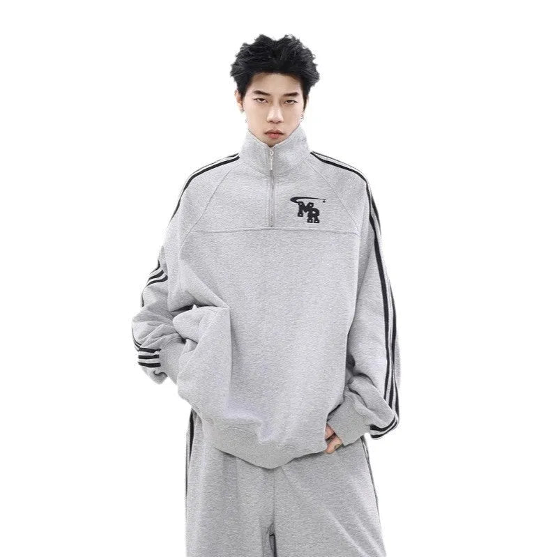 Black men's stand collar casual hoodie with long sleeves on a neutral background.