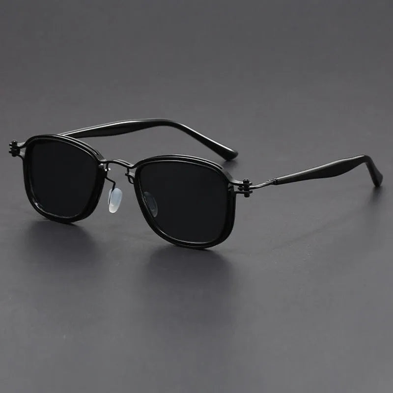 Retro style square frame sunglasses with metal and plastic construction in a black gold full gray colour.