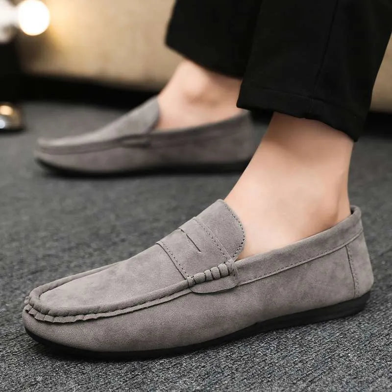 Men's Gommino Korean fashion slip-on shoes in black colour showing round toe and textured upper