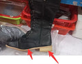Women's black artificial PU knee-high boots with cross strap design on the shaft