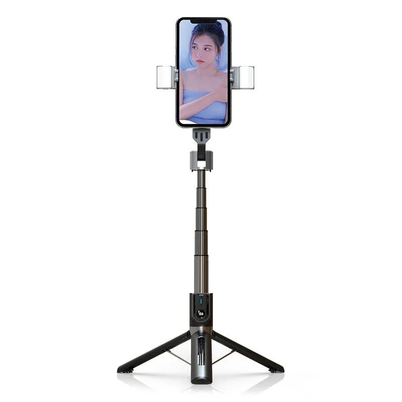 Black aluminium Bluetooth selfie stick with dual fill lights extended on a desktop.