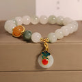Women's ice jade crystal bracelet with pearl accents and a Xiangyun peace jade buckle.