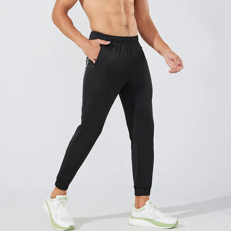 Men's black polyester running trousers with mid waist design and full length legs for exercise