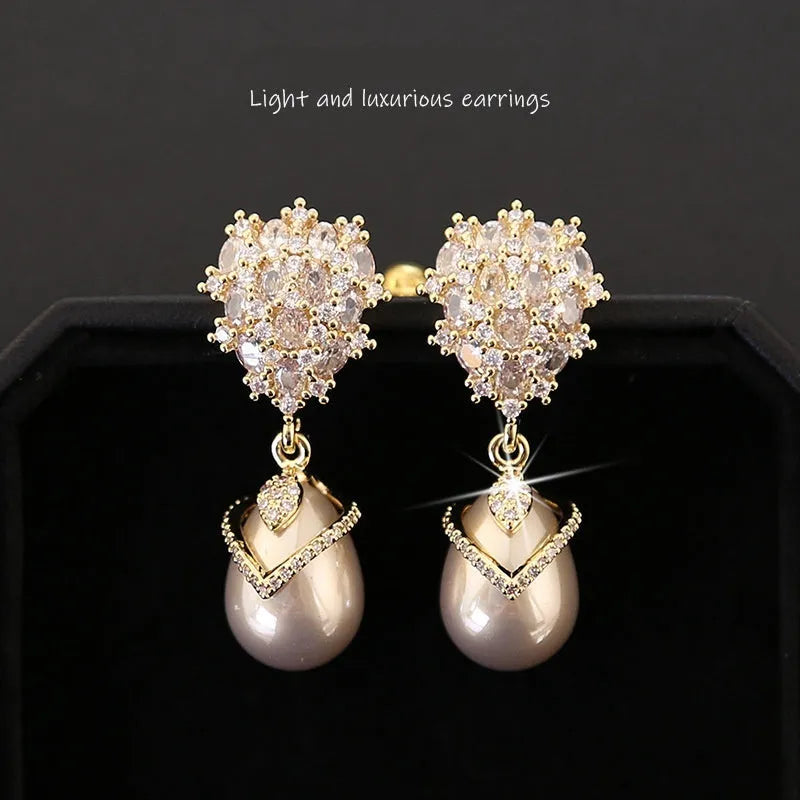 18K gold finish drop-shaped pearl earrings for women with zircon stones.