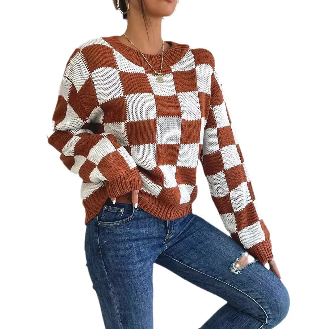 Dark brown plaid pattern on a loose round neck acrylic pullover sweater with long sleeves.