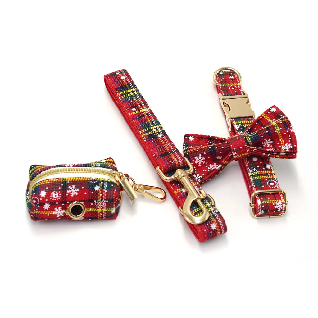 Red Christmas fabric pet collar set with matching harness, rope, bow, and waste bag