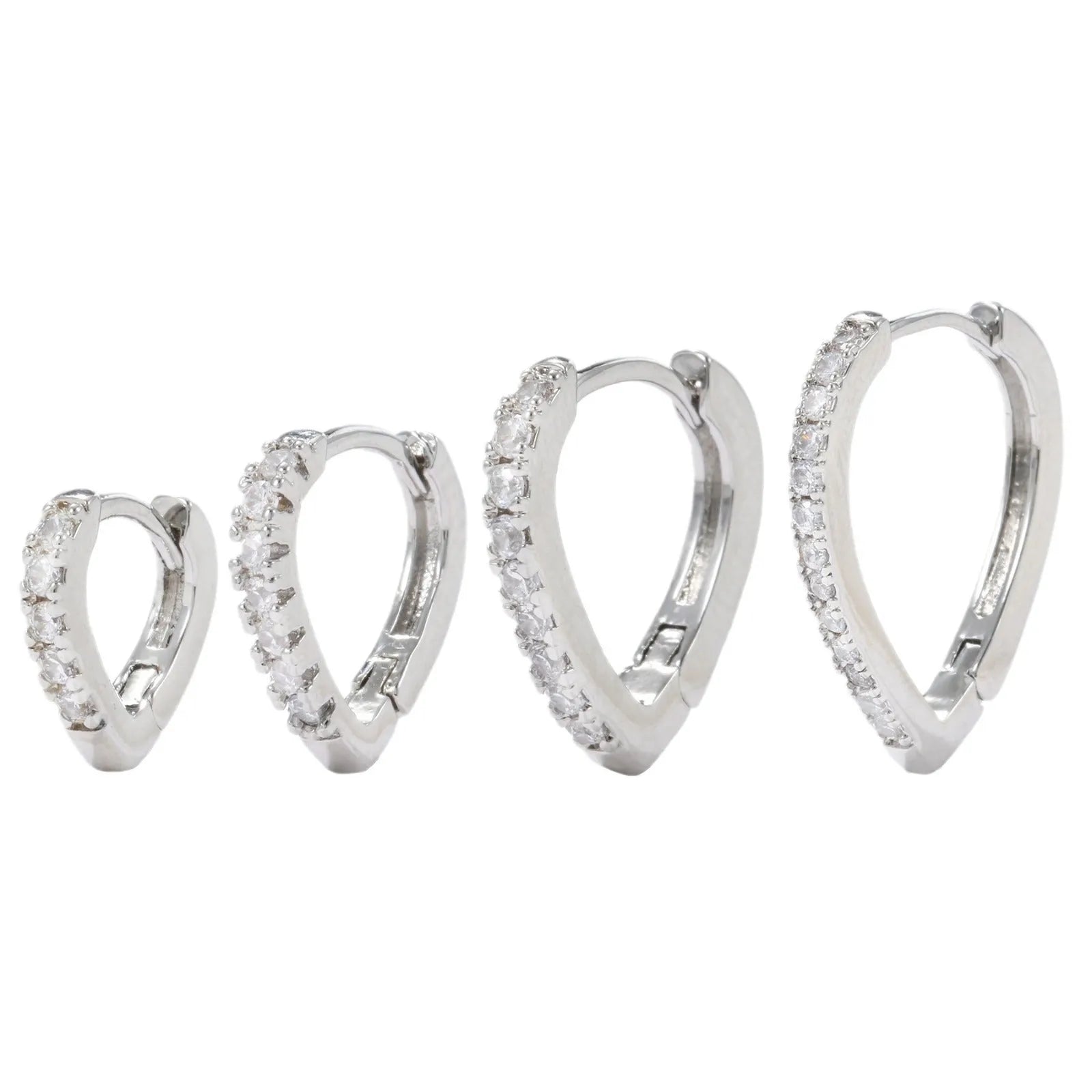 Geometric gold-coloured heart-shaped ear clip on a white background.