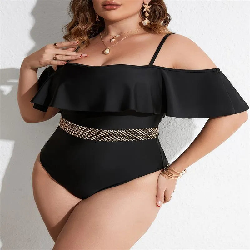 Black solid colour women's one-piece swimsuit on a hanger, polyester fabric, for swimming.
