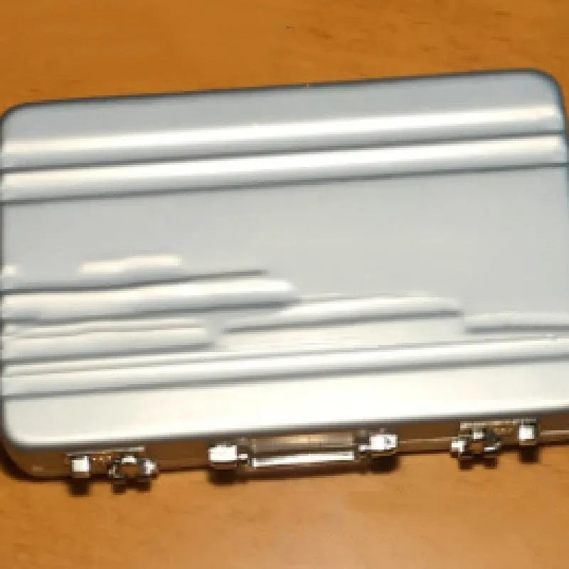 Slim aluminium metal card holder in six colour options: red, blue, black, silver, pink, and gold.