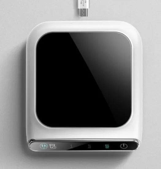 Black USB coffee heater with tempered glass surface showing three temperature settings and drinking water reminder