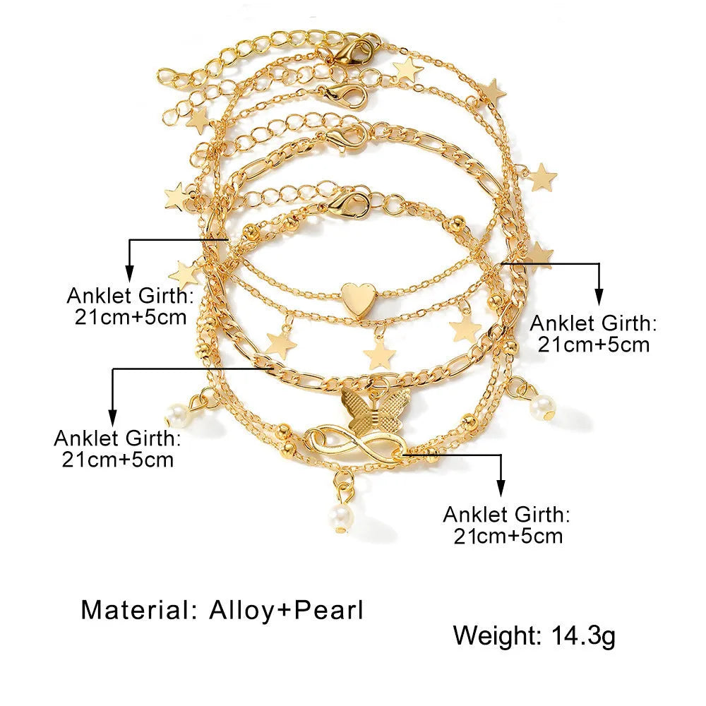 Four-piece women's alloy anklet set with butterfly and pearl heart charms in multi-layer design