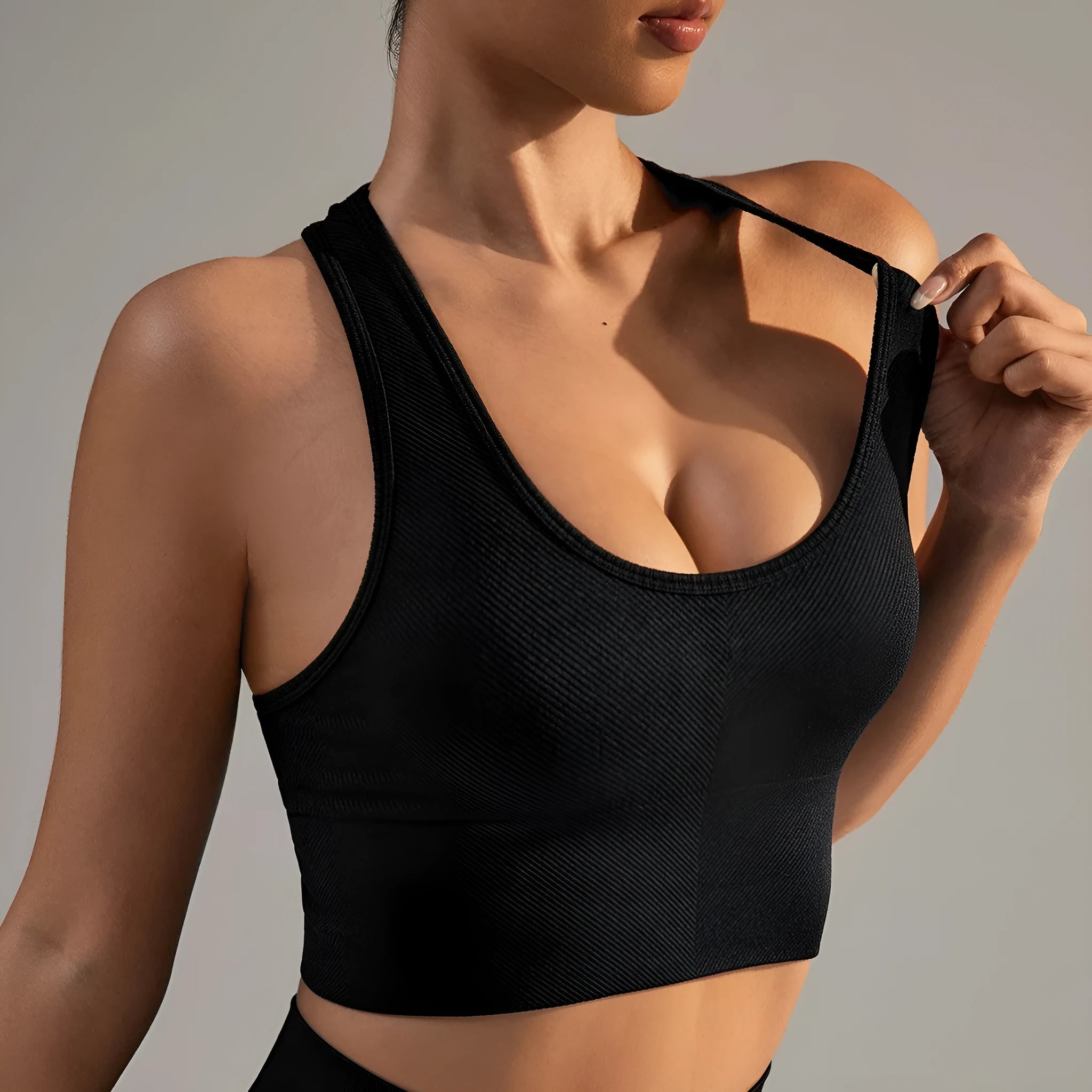 Black sports bra with cross-back design and full cup coverage