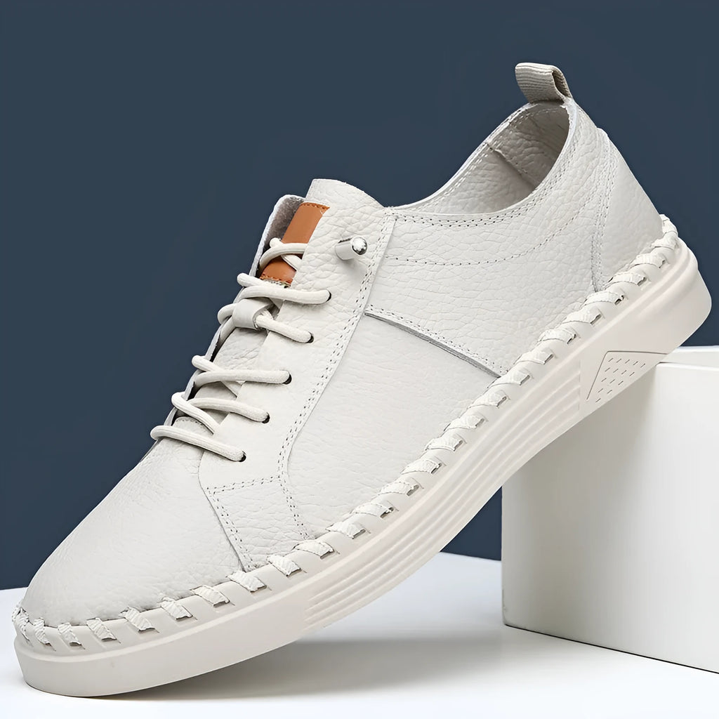 Men's beige and black cowhide leather sneakers with mesh lining and round toe.