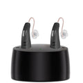 Behind-the-ear aid headset with simple charging bin, PVC housing in skin colour, silver finish