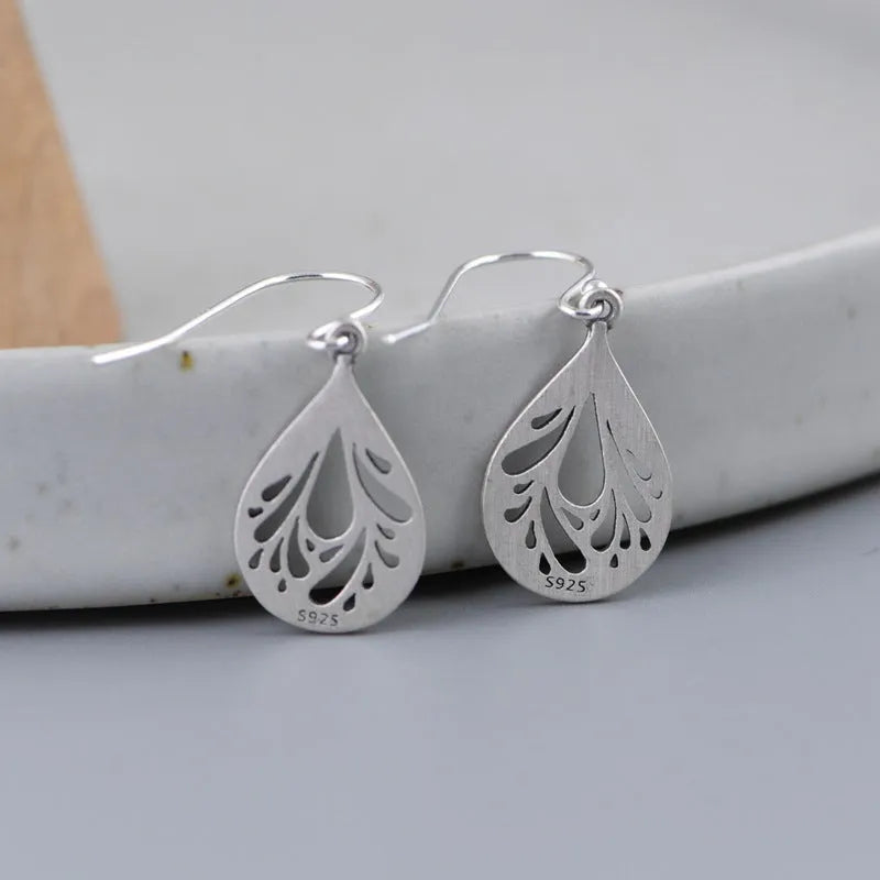 Pair of retro-style hollow water drop earrings made from 925 sterling silver