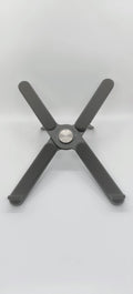 Foldable aluminium alloy laptop bracket in silver raised on a desk surface