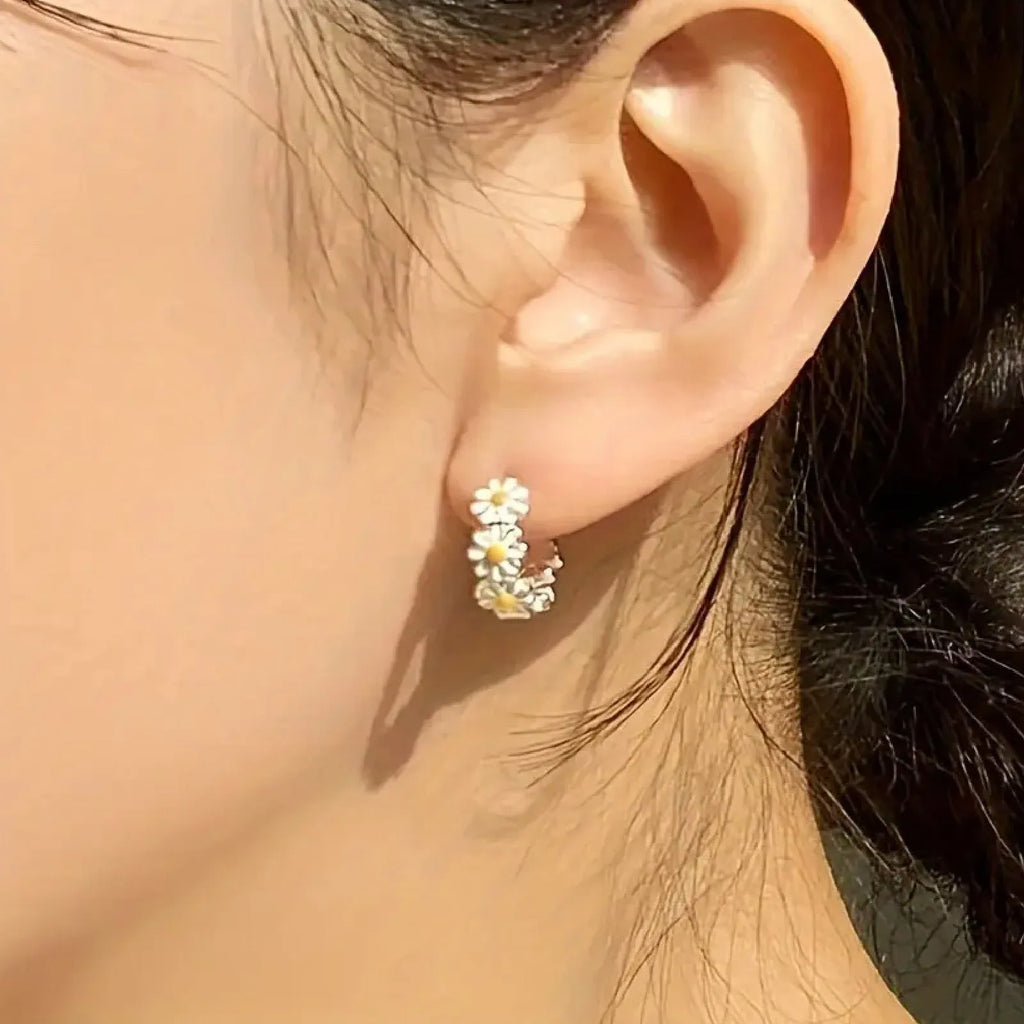 White daisy flower ring earrings with electroplated finish and platinum gem detailing