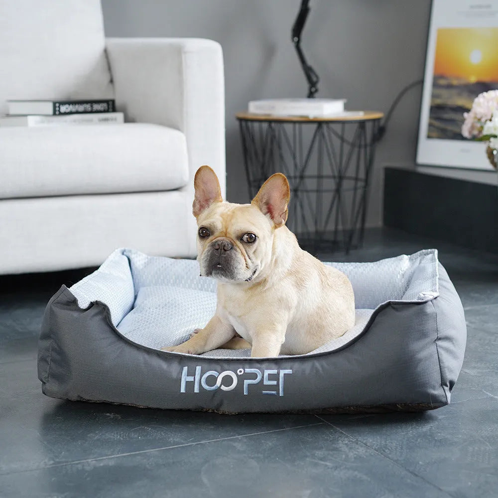 Soft grey pet bed with removable cover in small, medium, and large sizes for dogs and cats.