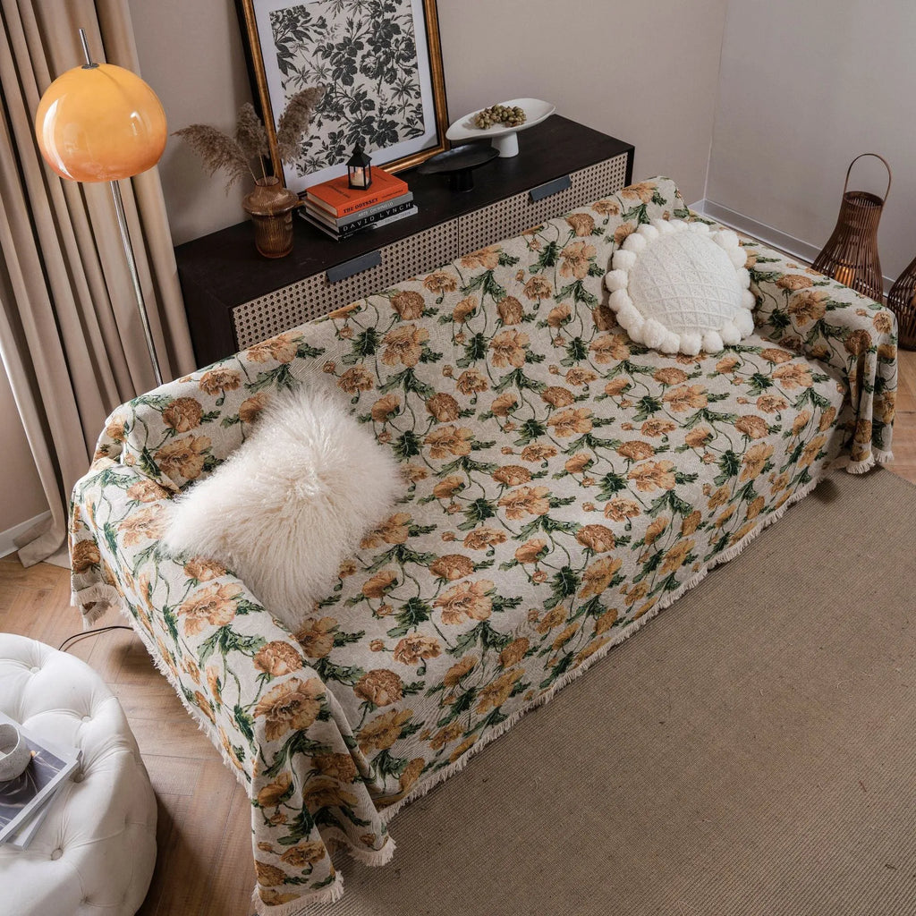 American country retro jacquard sofa cover in a cherry pattern on a white background, draped over a sofa.