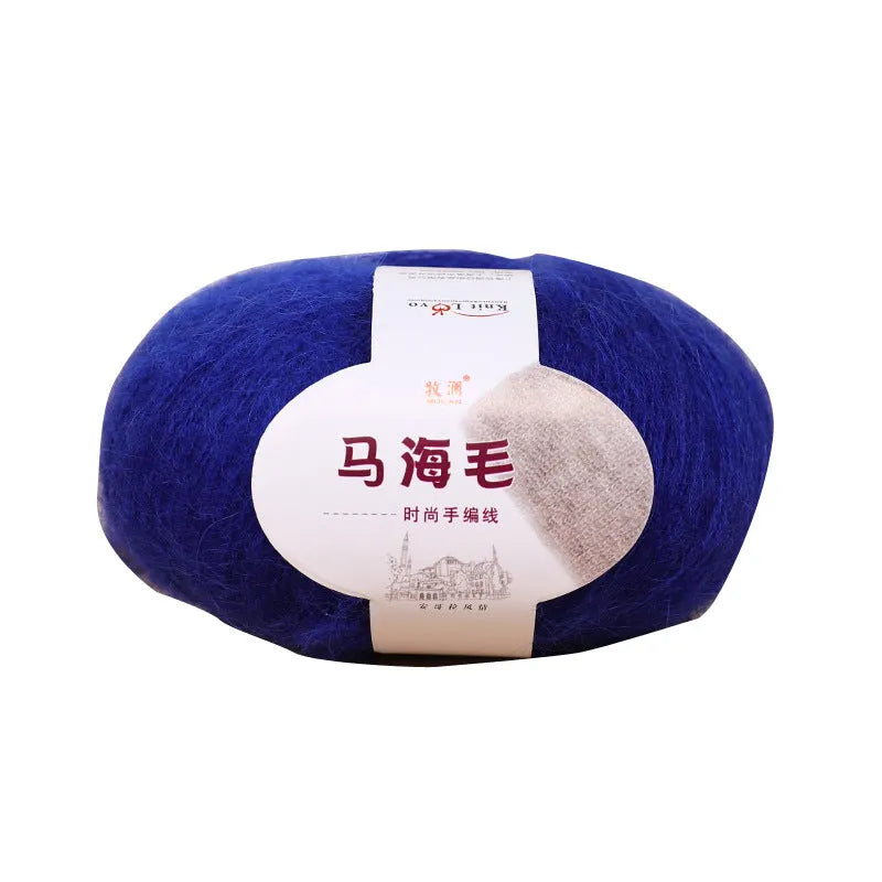 A ball of mohair yarn for a hand-woven DIY scarf kit, shown with a selection of its 34 colour options.