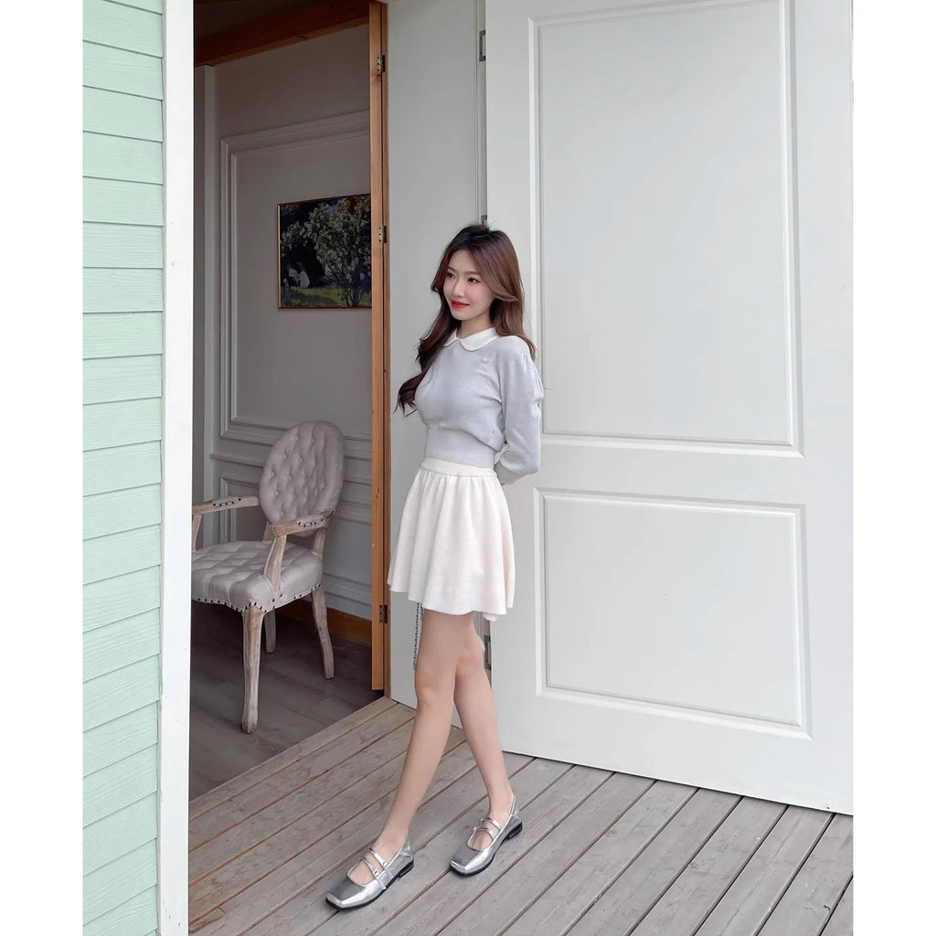 Women's silver genuine leather Mary Jane flats with a cross buckle strap and low flat heel.