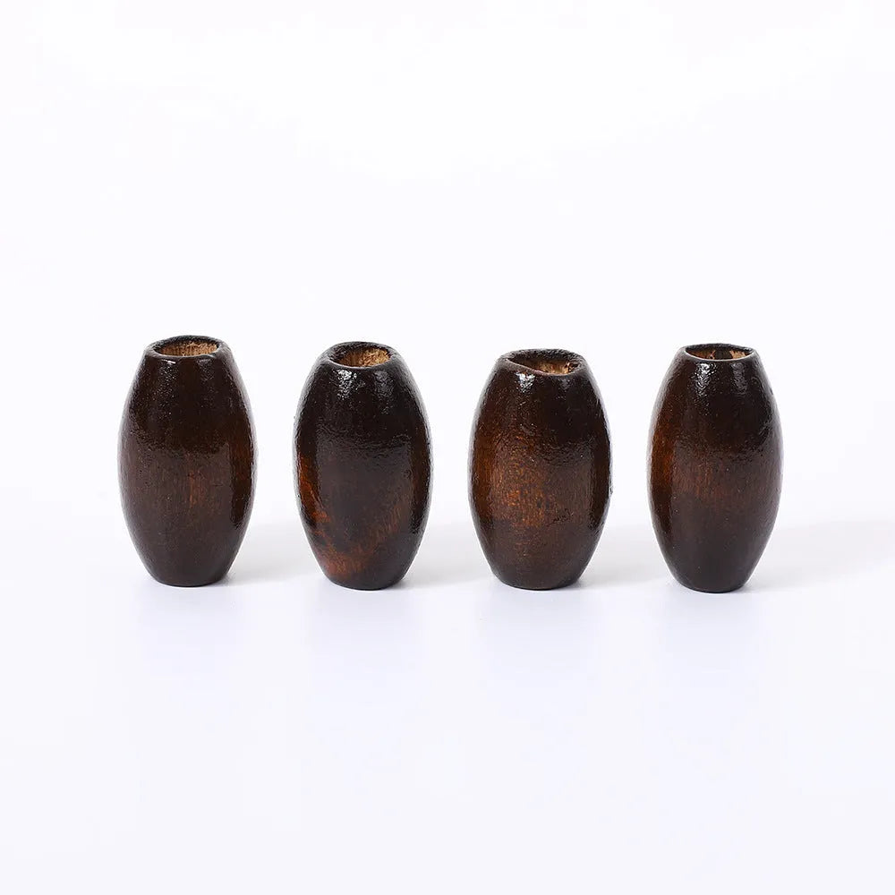 Dark coffee coloured oval wooden bead with M-shaped texture, shown next to a ruler showing 25mm size.