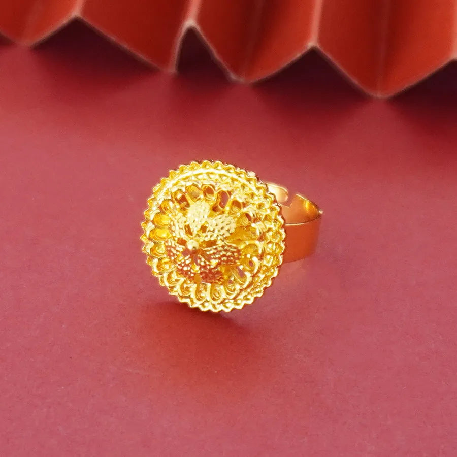 Gold-plated three-piece jewellery set with necklace, earrings, and ring featuring floral design patterns