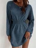 Blue women's knitted dress with hand-crocheted floral details, a round neck, and a fitted waist.