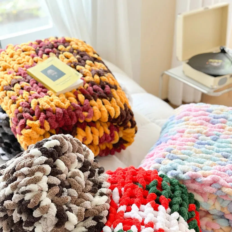 Handmade thick chenille striped blanket in caramel mango colour on a bed
