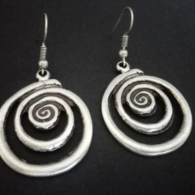 Silver geometric spiral distressed alloy earrings with national style design measuring 2.6 cm wide by 5 cm long