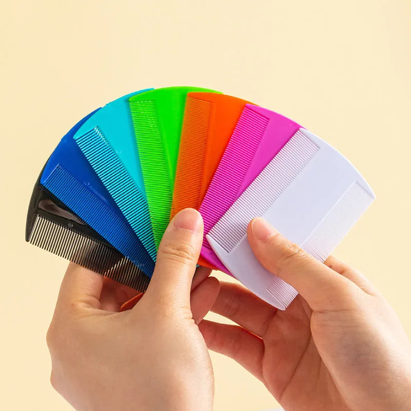 A plastic fine-toothed double-edged flea and lice comb in assorted colours, shown at actual size of 8cm by 7.5cm.