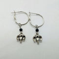 Silver alloy round hoop earrings with a Tibetan antelope design detail.
