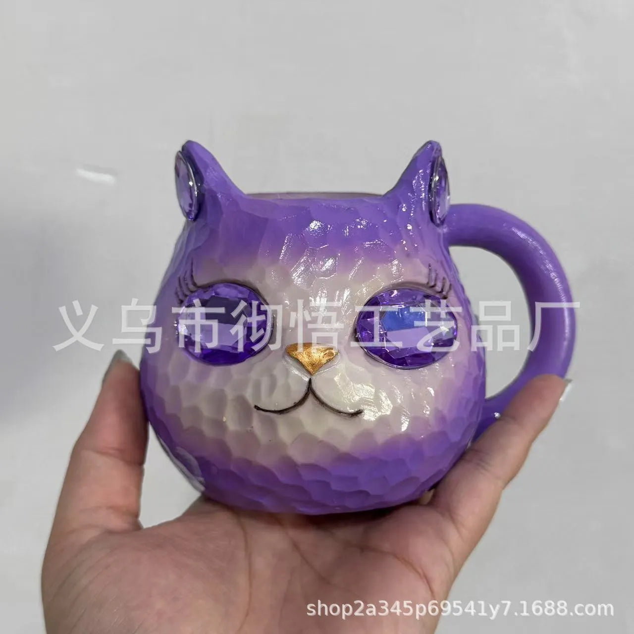 Clear resin Cat Cup ornament in purple, green, blue, and pink colour options on display.