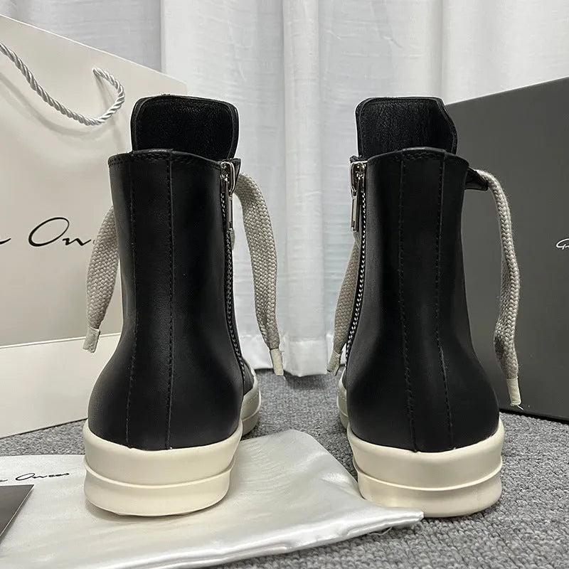 Black genuine leather high-top sneakers with side zipper and platform sole.