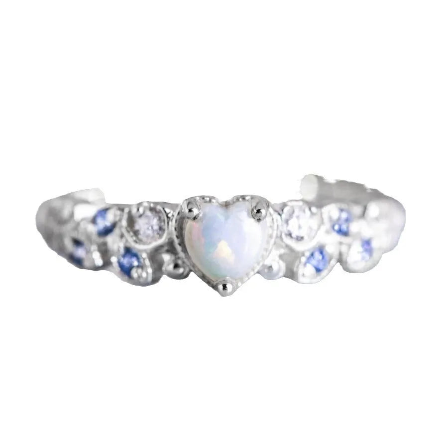 Women's peach-coloured heart-shaped alloy ring with floral and opal ocean detailing.