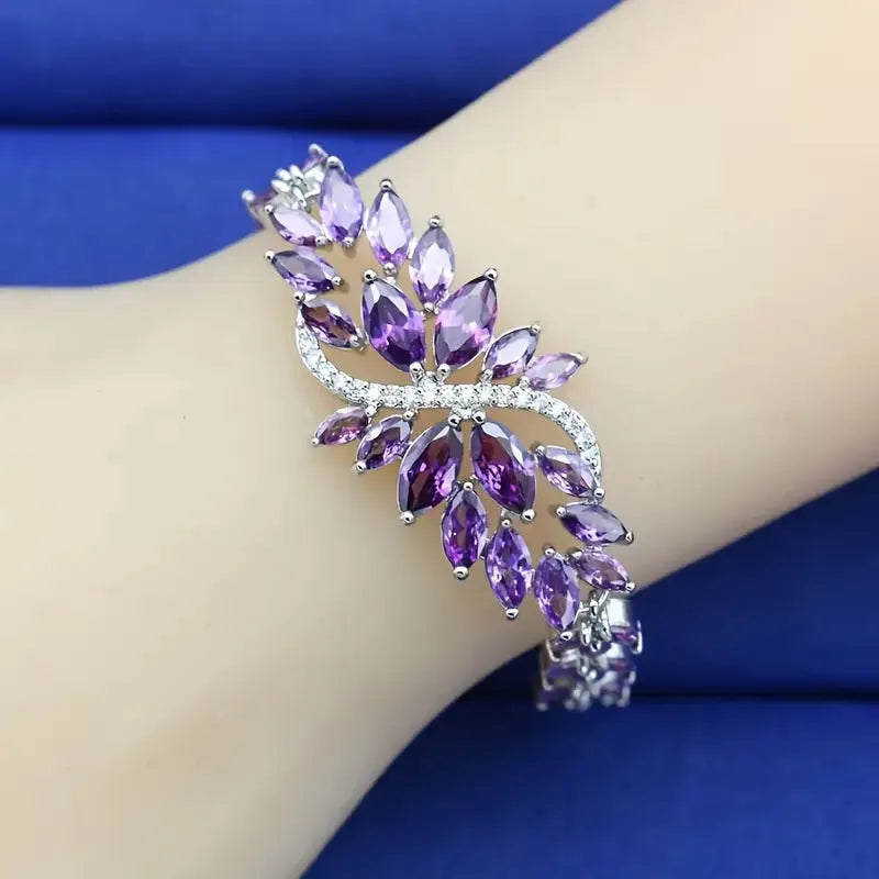 Gold electroplated bracelet with coloured zircon stones and ice flowers pattern on copper.