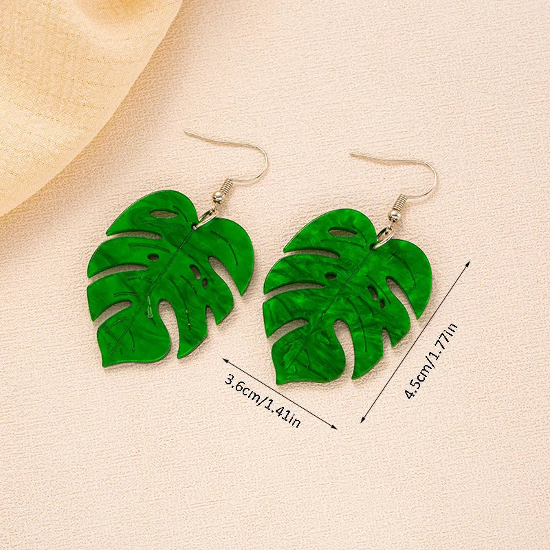 Acrylic drop-shaped earrings with coconut leaf pattern in one of five colours on an alloy hook.