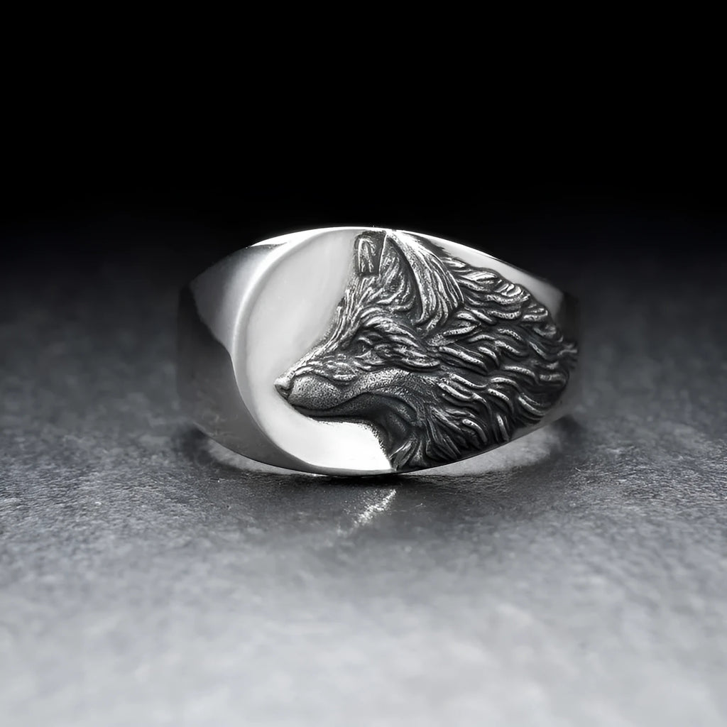 Men's silver alloy ring with a geometric wolf head design on a signet ring band.